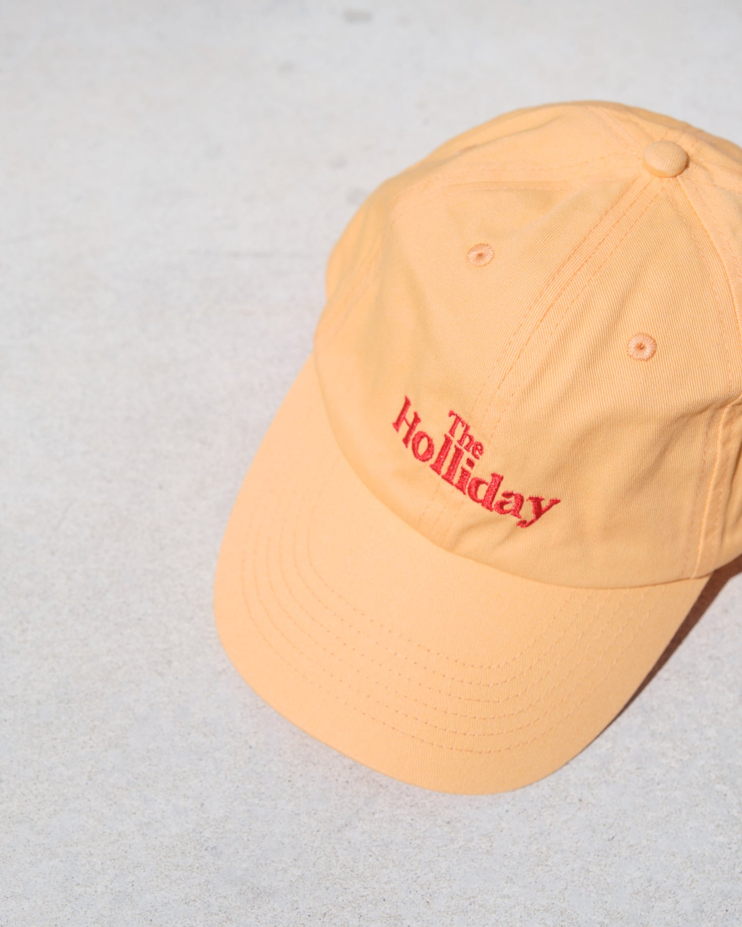 The Holliday. Cap