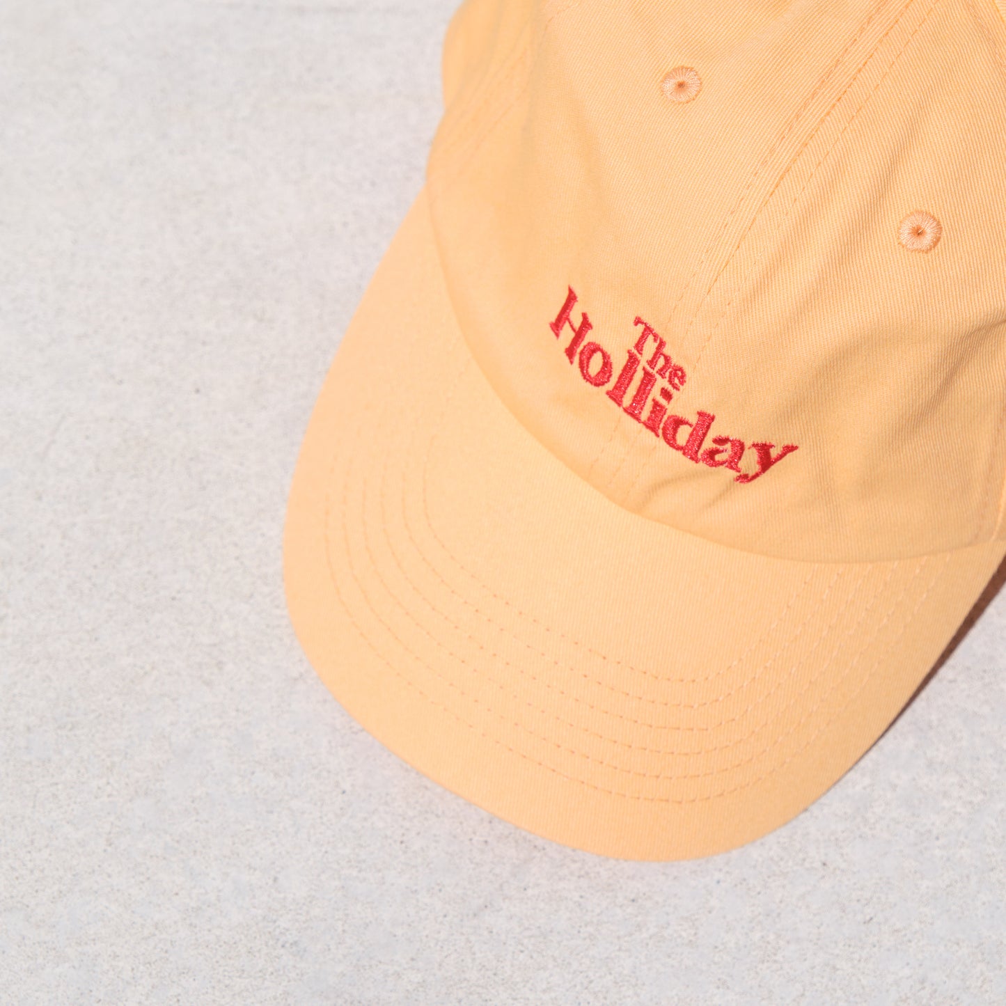 The Holliday. Cap